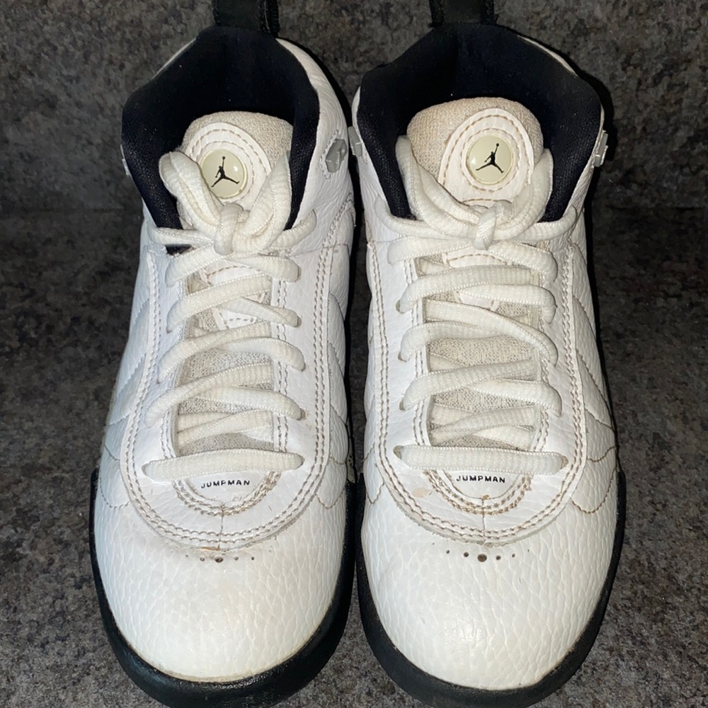 White Air Jordan’s with black trim. Excellent used condition.